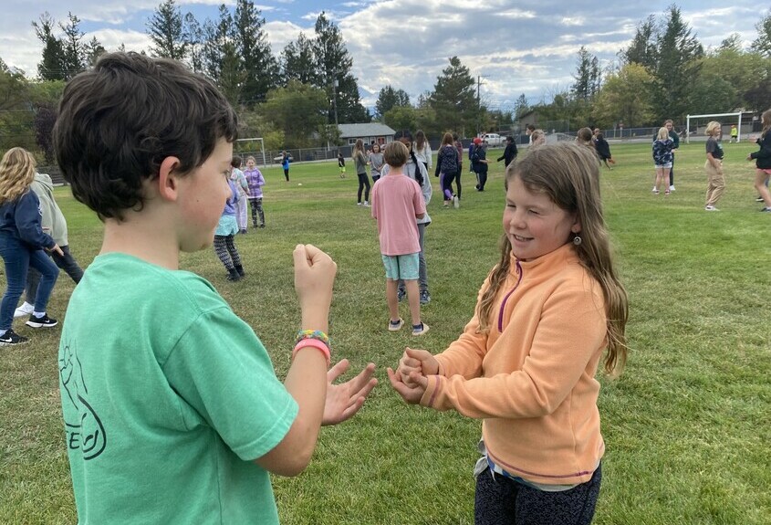 Students playing Rock, Paper, Scissors